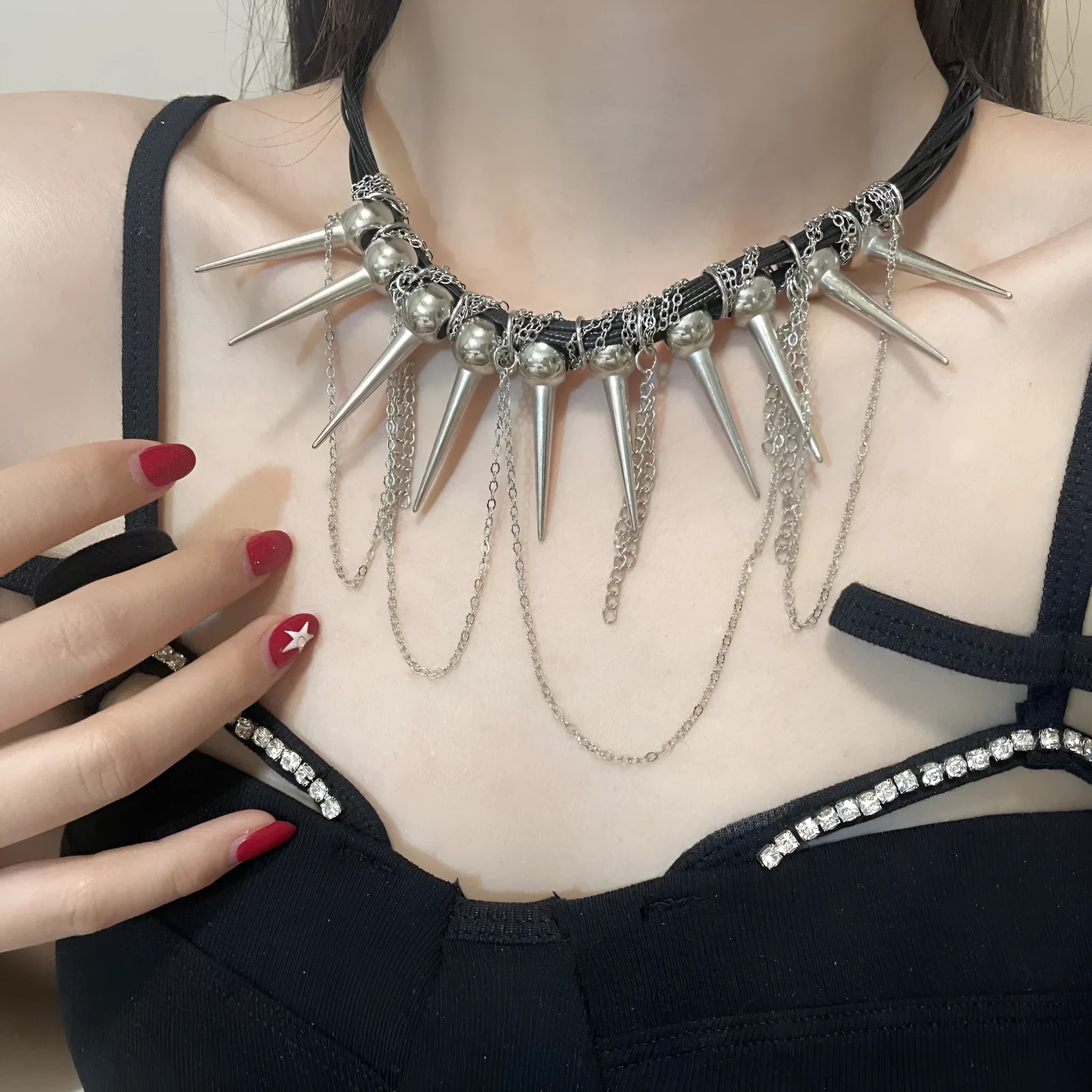 Leather necklace with round beads and winding tassel featuring rivet details in picture colour