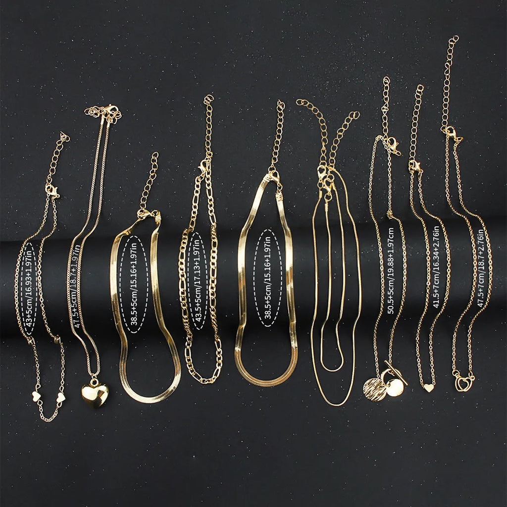 Women's gold necklace set with 10 alloy pendants on adjustable snake bone chain