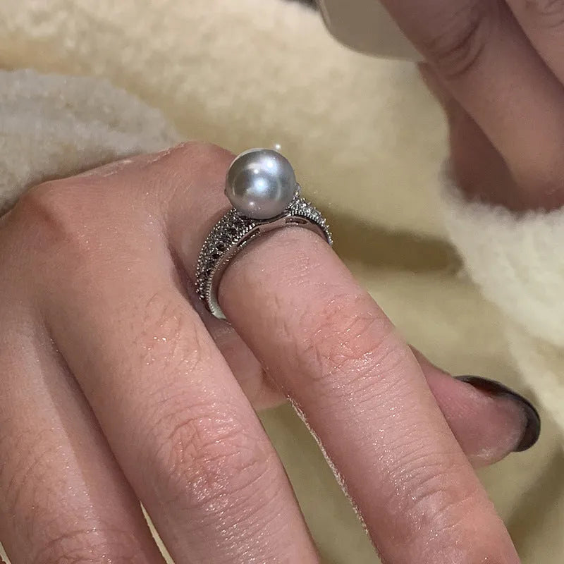 Black pearl geometric open ring with adjustable opening on index finger