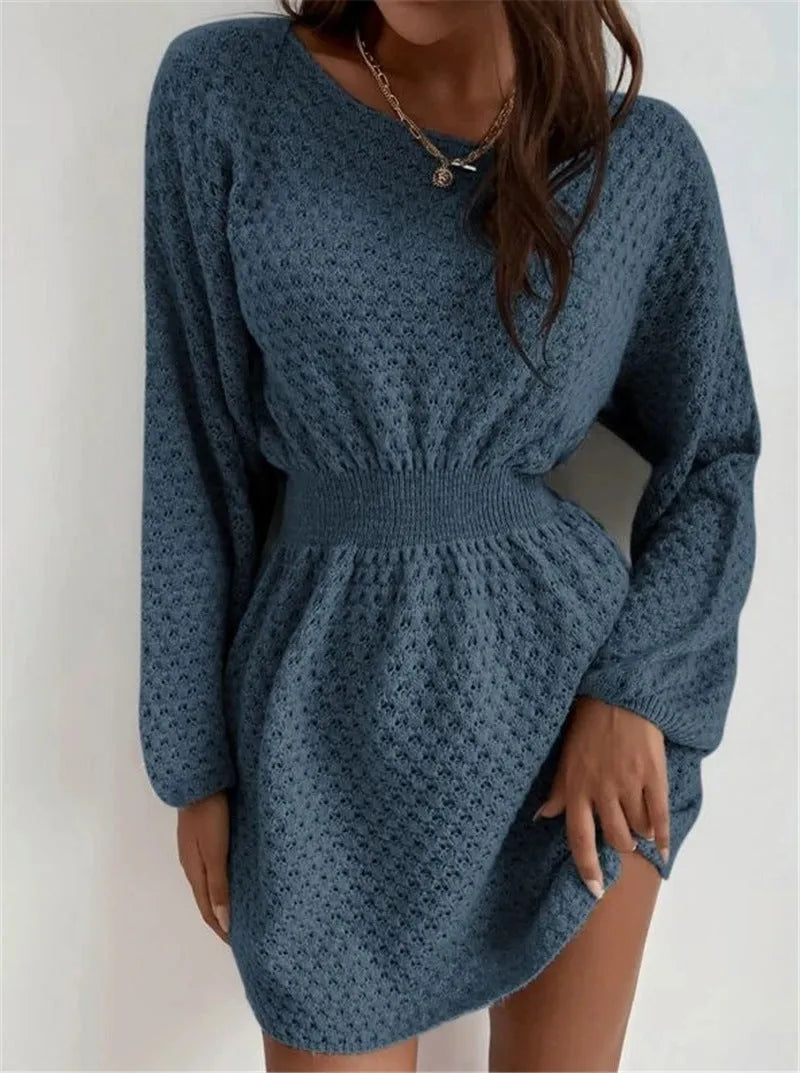 Blue women's knitted dress with French neckline, fitted waist, and hand-crocheted flower detailing