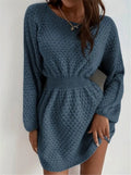 Blue women's knitted dress with French neckline, fitted waist, and hand-crocheted flower detailing