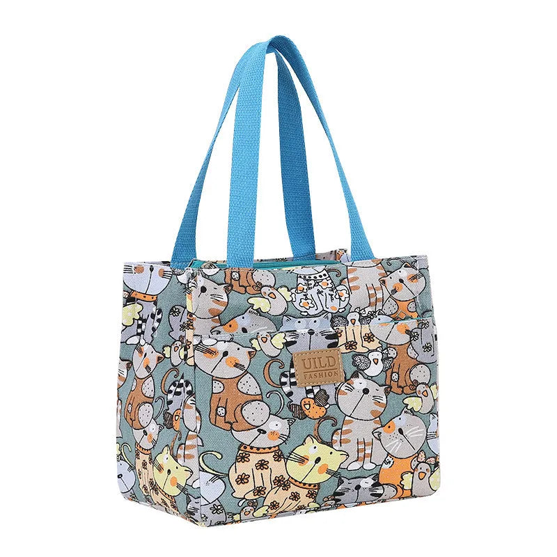 Women's printed canvas handbag with aluminium hardware in a selection of floral and animal designs.