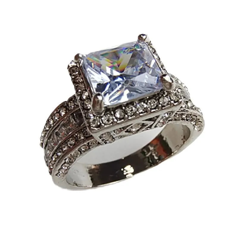 Geometric women's ring in gold or white electroplated alloy showing round elements and UK size markings