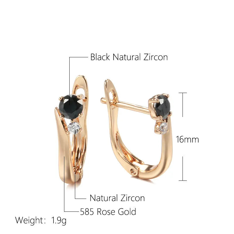 Gold coloured drop earrings with black agate stone centre and geometric design on copper settings