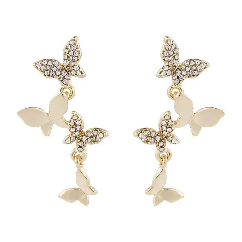 Women's copper butterfly drop earrings with four-butterfly design in gold colour