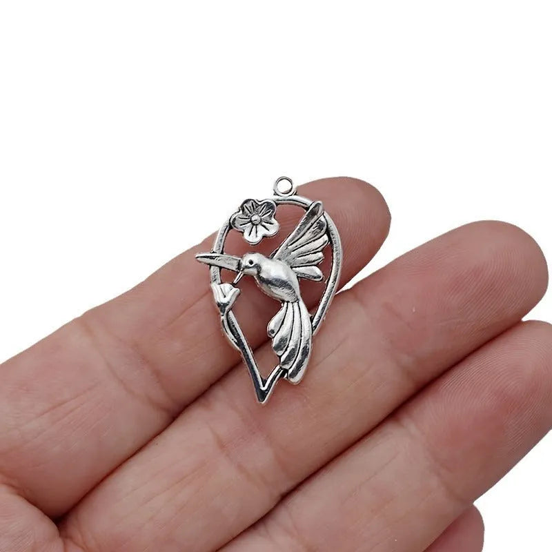 Alloy flying magpie pendant charm with electroplated finish in colour P234 for DIY jewellery making