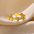 Geometric titanium steel women's ring with gold diamond setting on finger