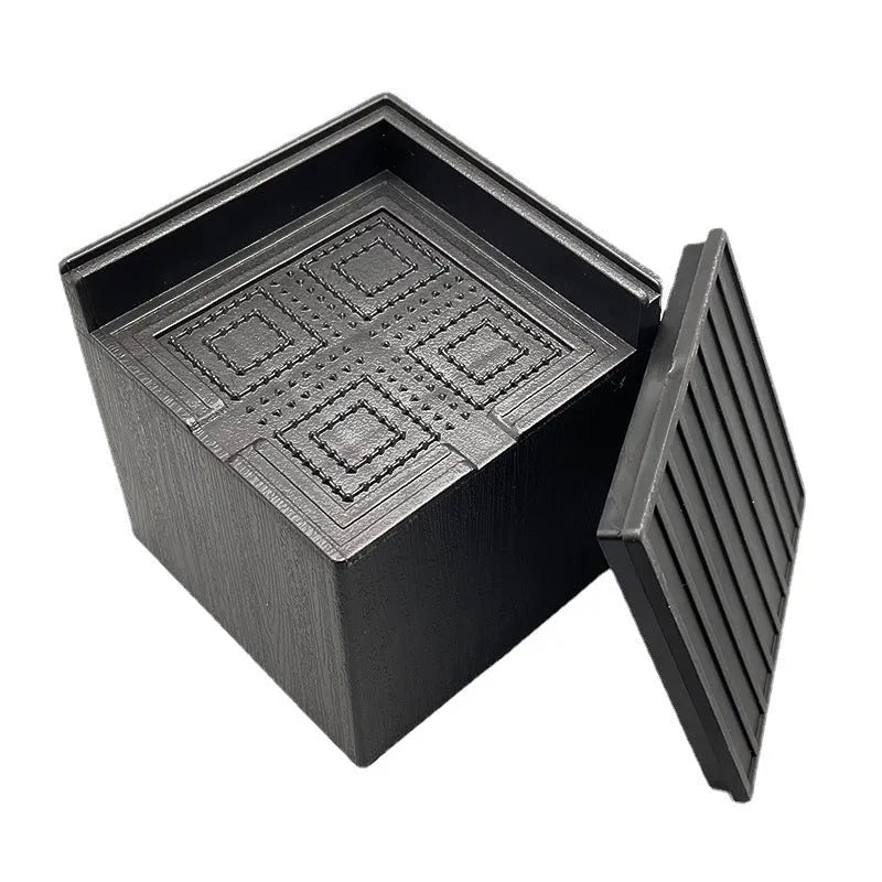 Four black thickened plastic bed foot mats for raising sofa and furniture height.