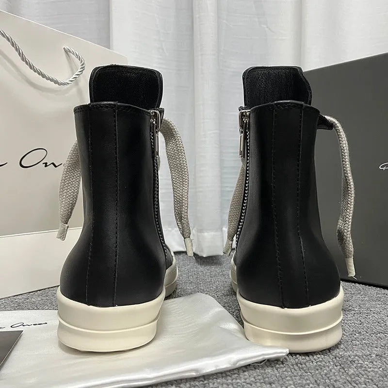 Genuine leather high-top unisex sneakers with side zipper in black, shown on a neutral background.
