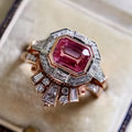 Rose gold-tone women's retro style ring with geometric ruby design on a hand.