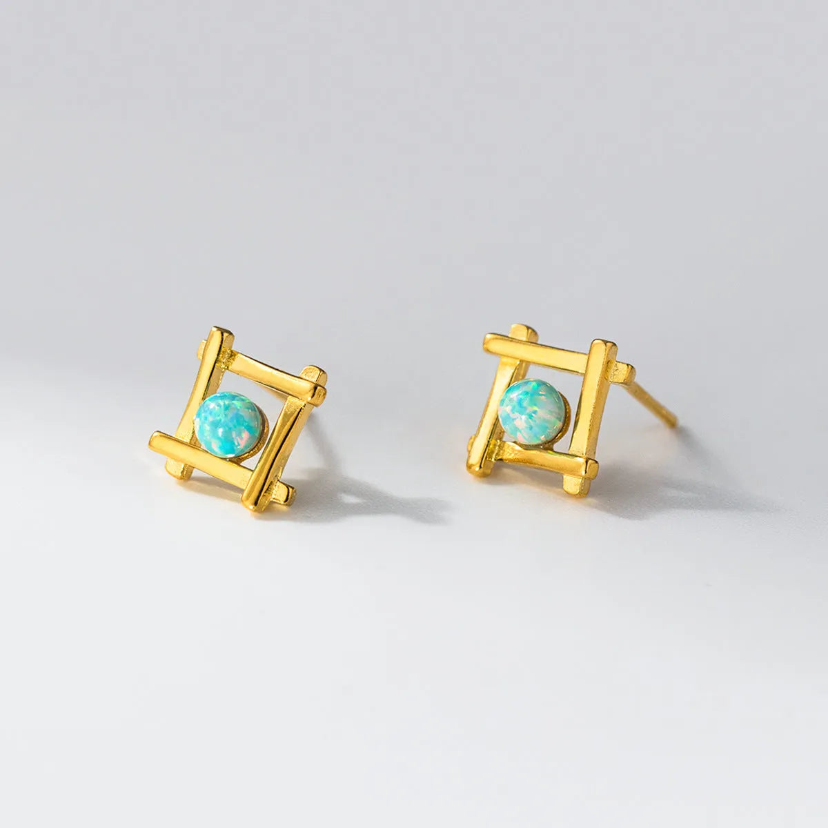 Women's geometric cross quadrangle stud earrings in sterling silver with silver or gold plating