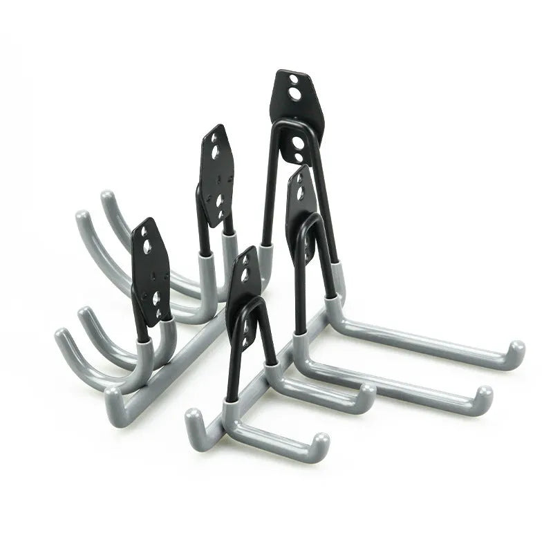 Carbon steel wire-wrap board storage rack with fixed hooks in bright orange finish on wall holding tools