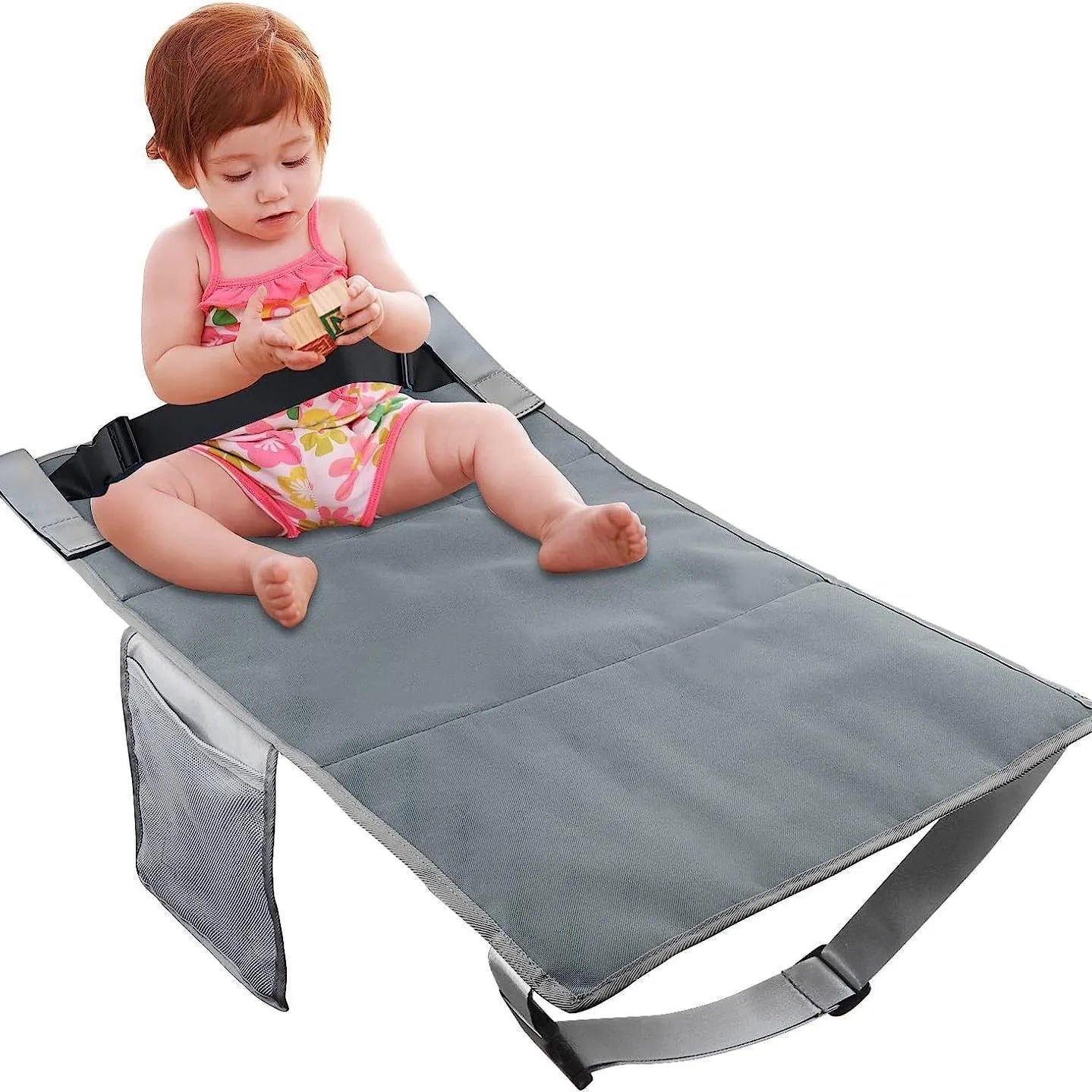Portable grey nylon children's aircraft pedal seat extender with drawstring pocket, shown folded.