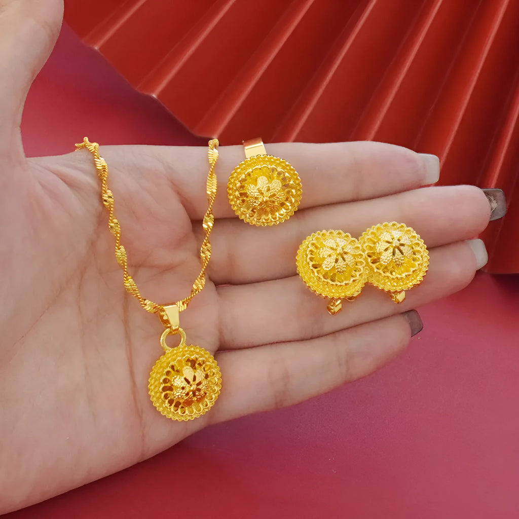 Landscape Middle East gold-plated three-piece jewellery set showing necklace, earrings, and ring with layered floral design.