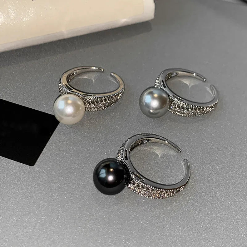 Black pearl geometric open ring with adjustable opening on index finger