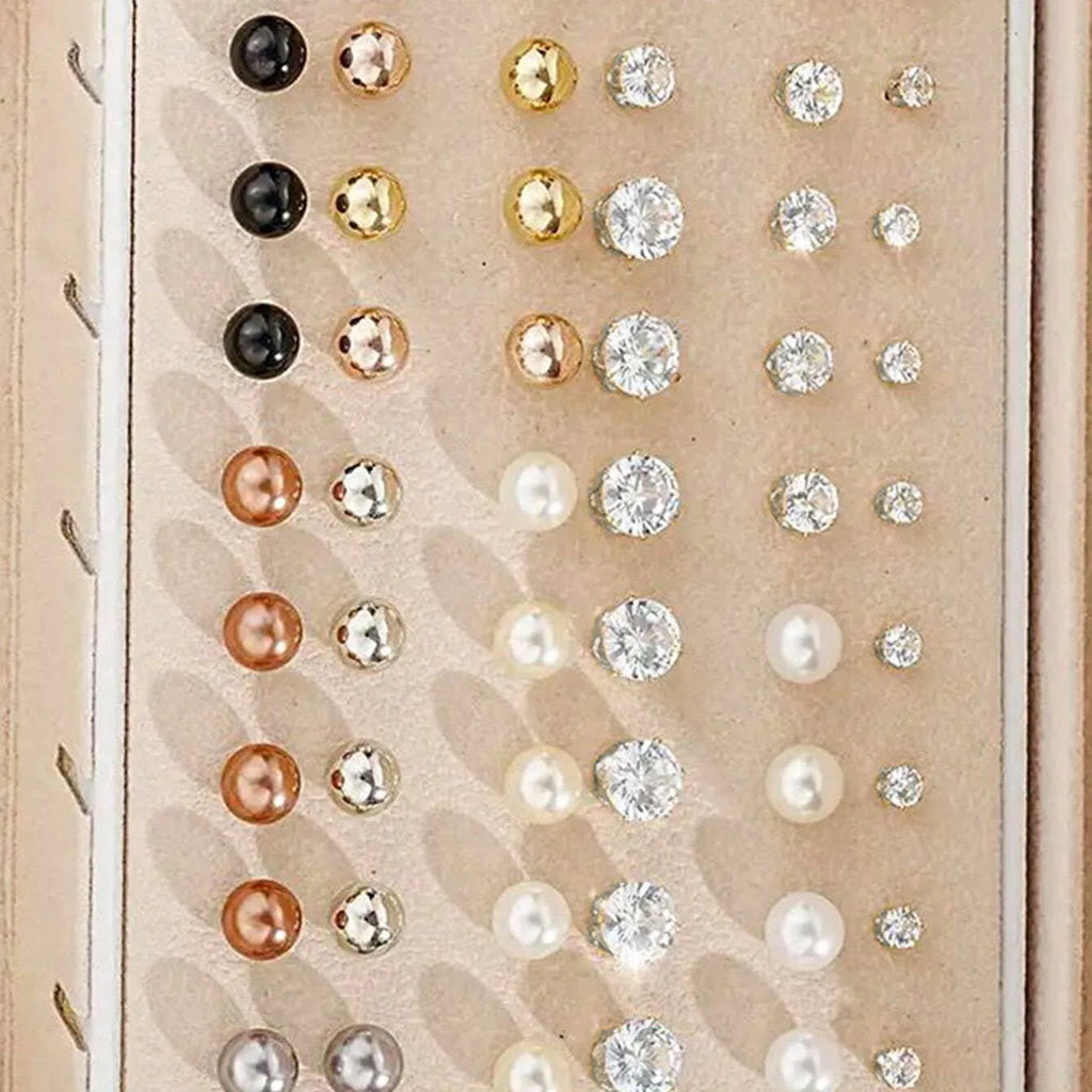 108 gold and yellow geometric round pearl earrings spread out, showing electroplated alloy construction.