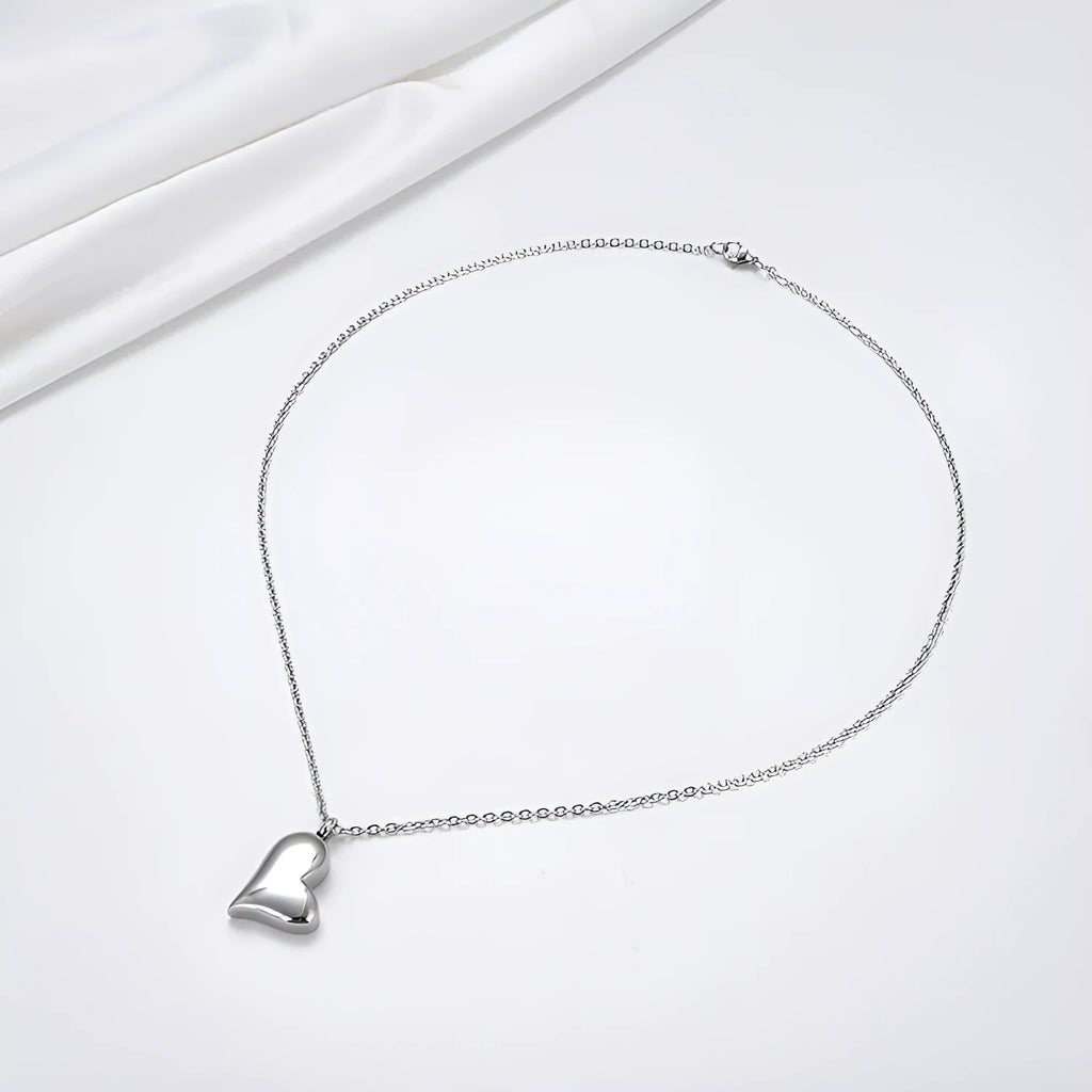 Silver curved heart pendant on adjustable stainless steel necklace chain