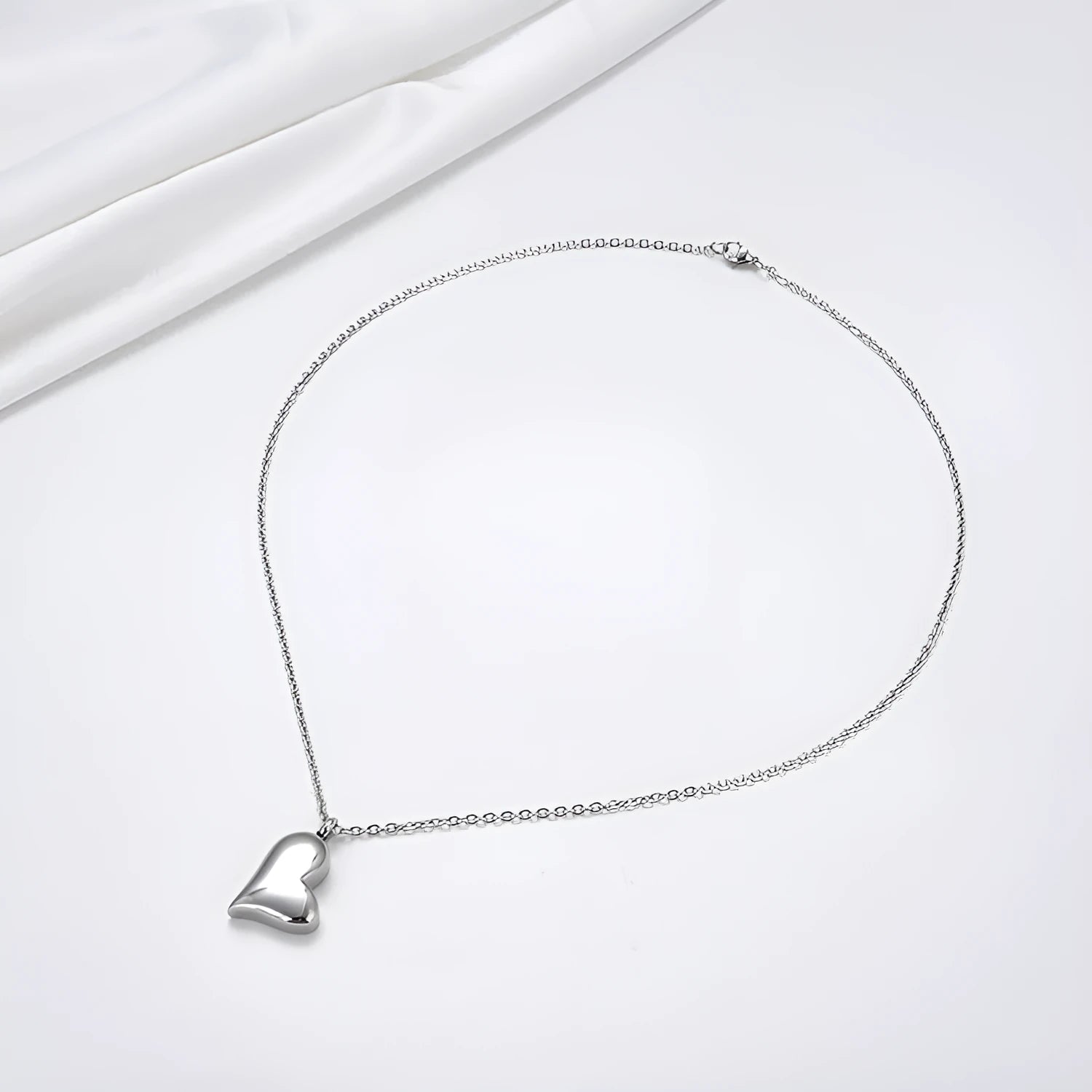 Silver curved heart pendant on adjustable stainless steel necklace chain