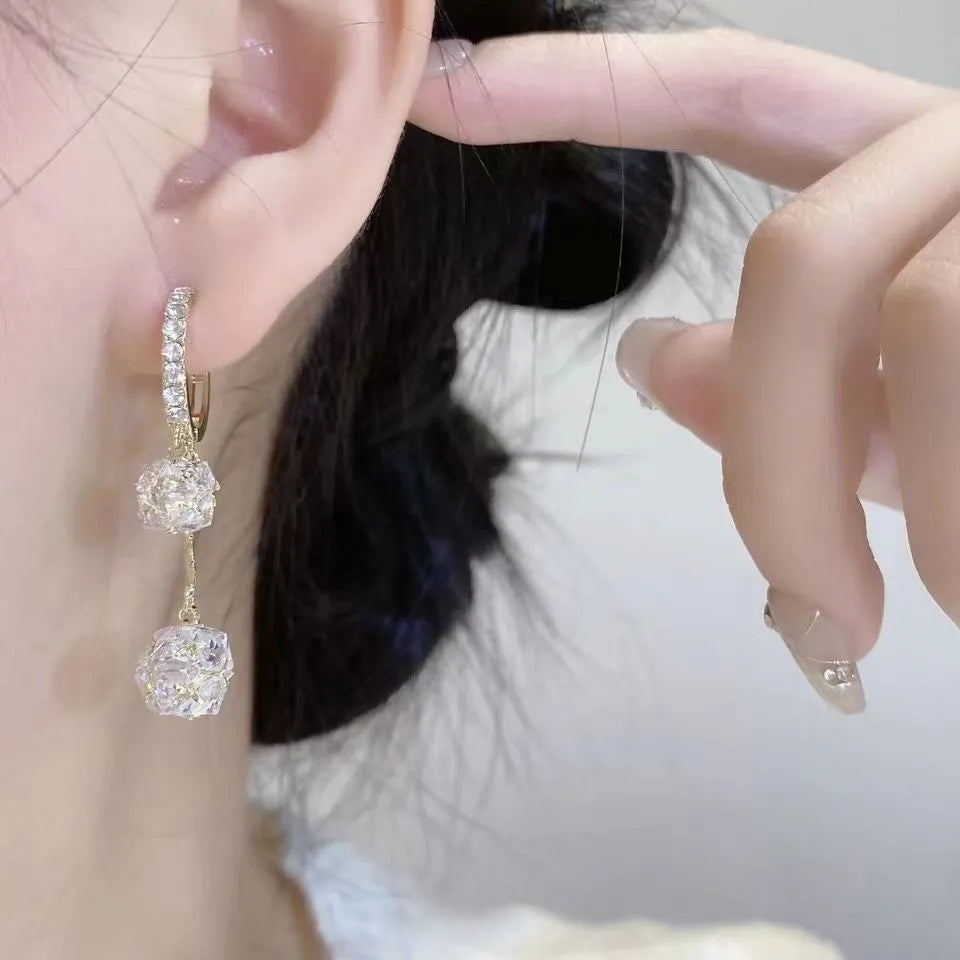 Silver copper earrings with tassel ball and rhinestone ball design in drop shape
