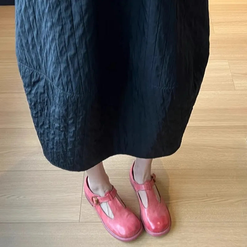 Women's retro round toe pumps in pink brush colour with low heel and buckle closure