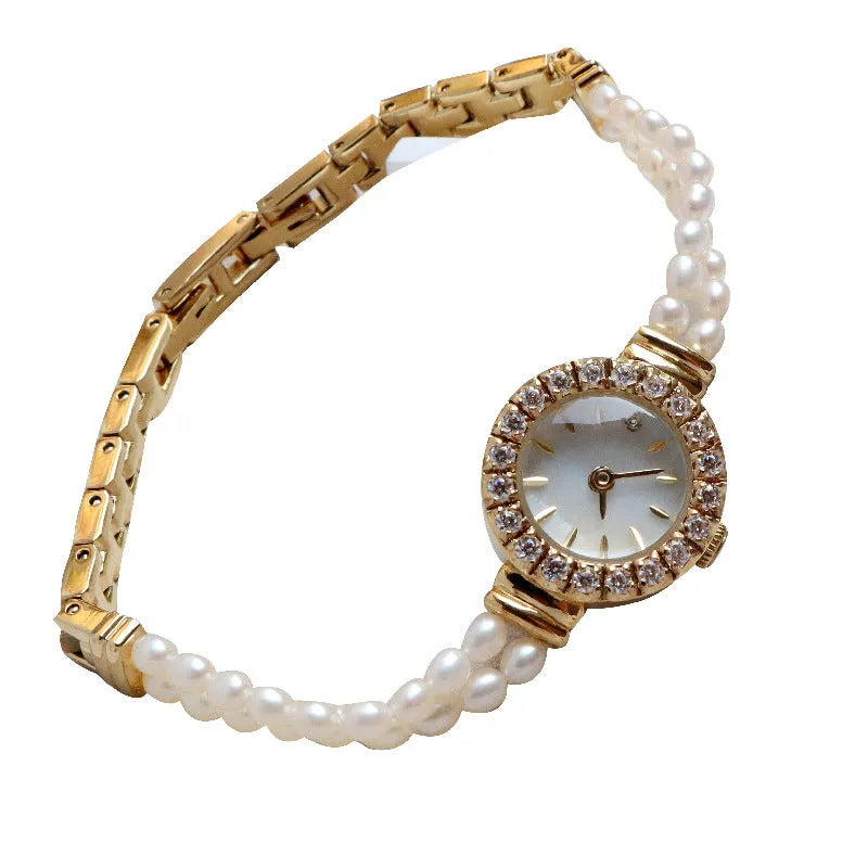 Women's light gold bracelet watch with freshwater pearls, round dial and stainless steel strap