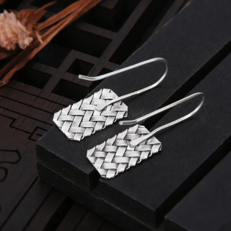 925 silver geometric woven diamond plaid earrings on a plain background