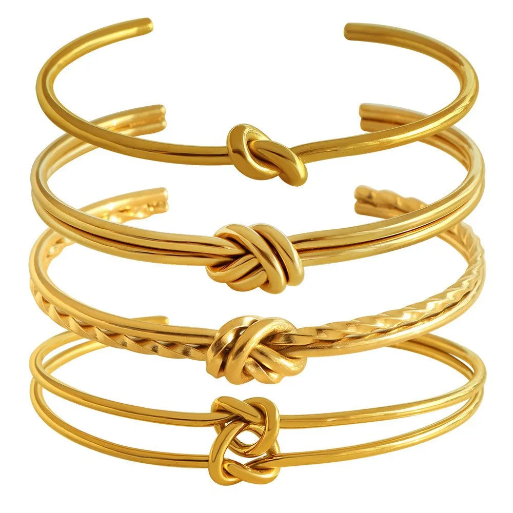 Stainless steel 18K gold plated knotted open double-layer bracelet in gold (SZ46G) on a white background