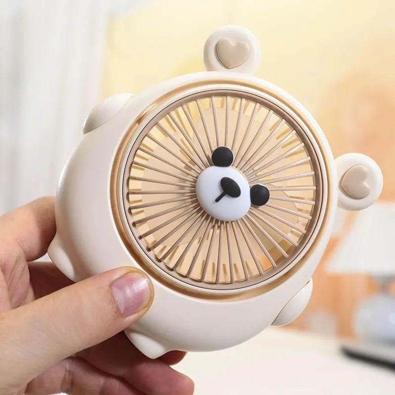 Cute dog-themed USB desktop fan in choice of puppy and bear colours on a desk