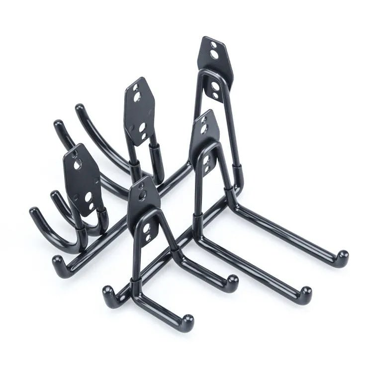 Carbon steel wire-wrap board storage rack with fixed hooks in bright orange finish on wall holding tools