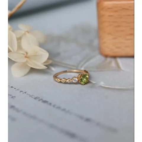 Japanese style copper ring with quadrilateral geometric design and imitation peridot centrepiece
