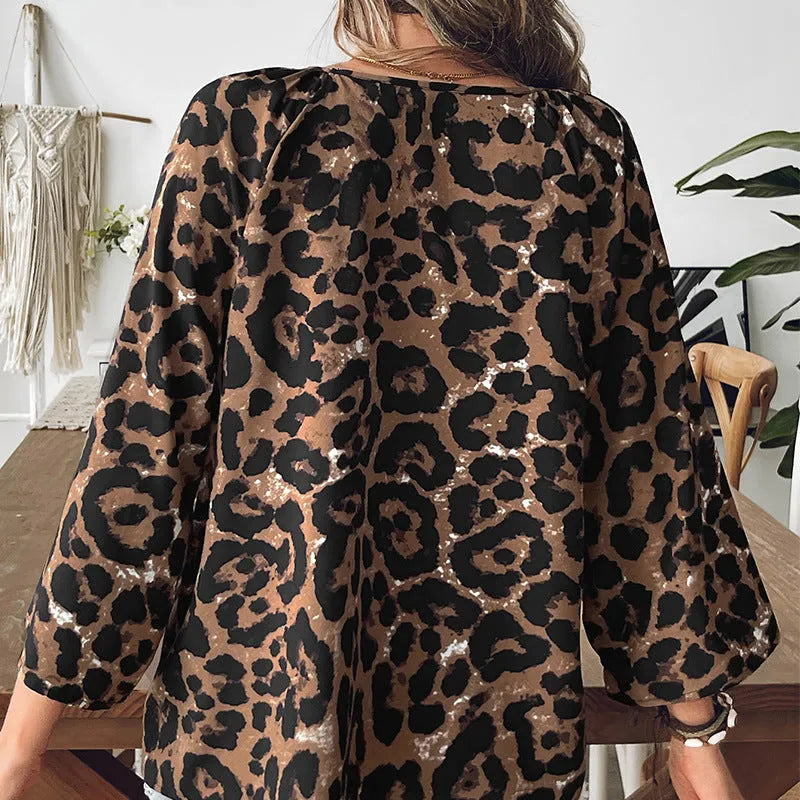 Women's multicolour leopard print polyester pullover top with V-neck and half sleeves.