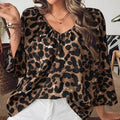 Women's multicolour leopard print polyester pullover top with V-neck and half sleeves.