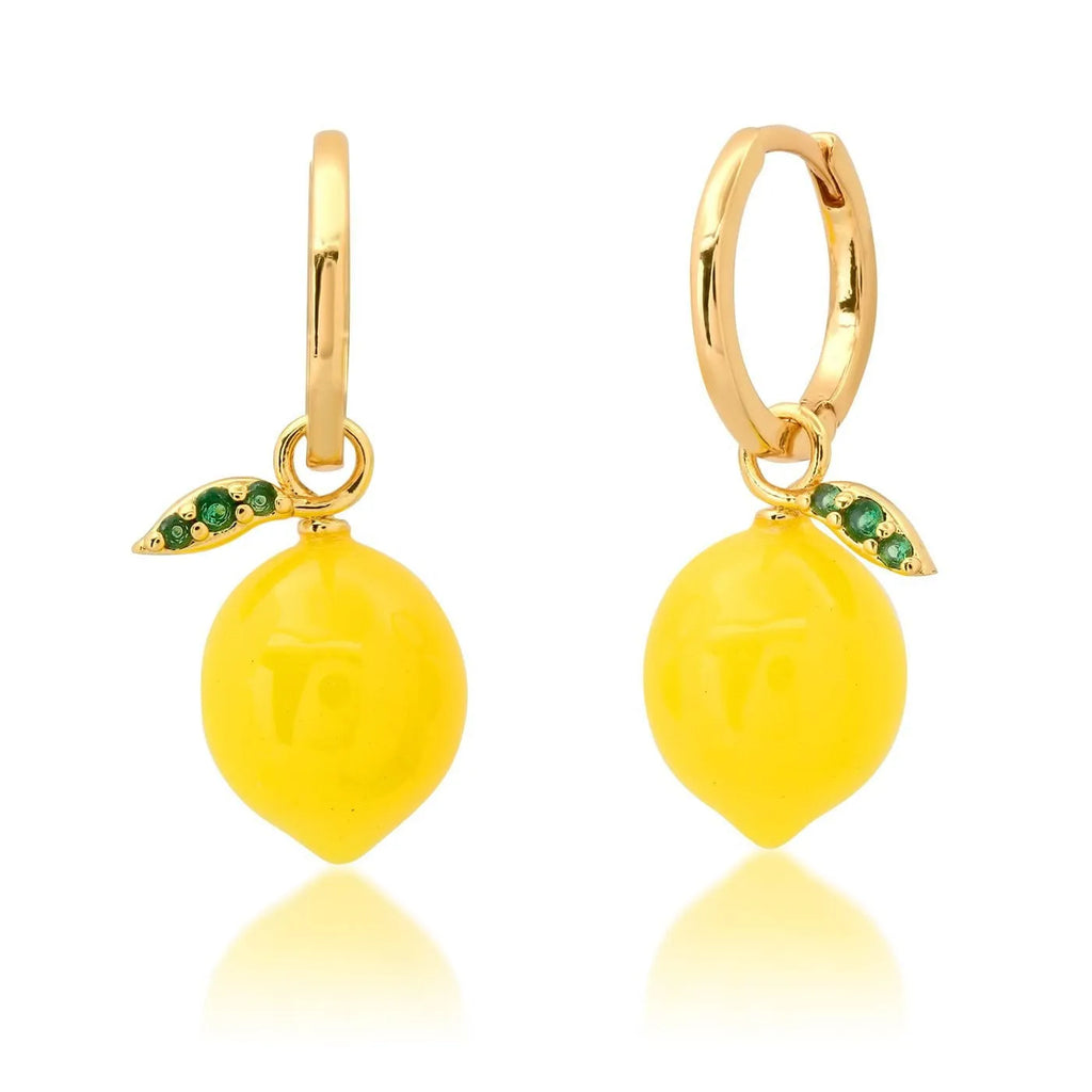Gold plated copper earrings featuring fruit and vegetable shapes in multiple colours on display