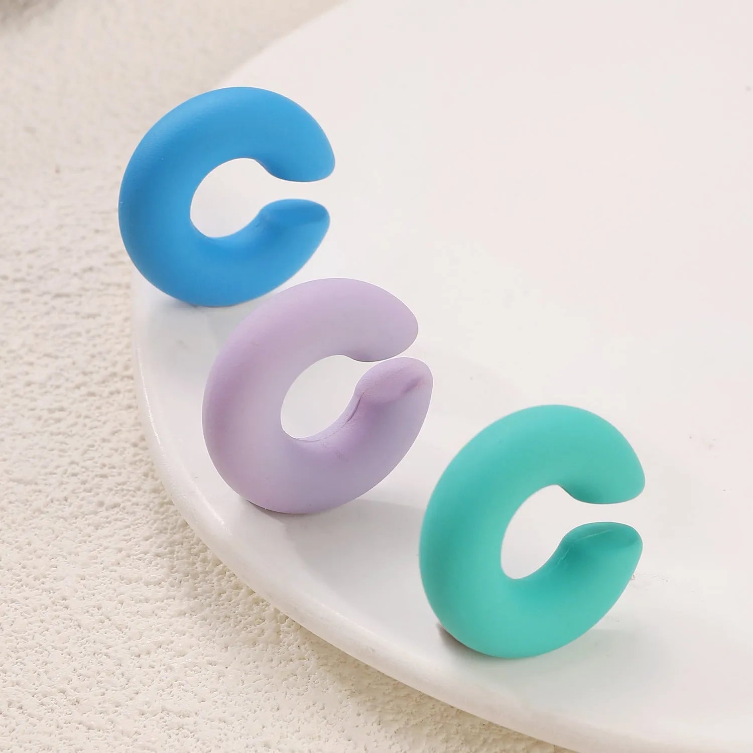 Geometric C-shape matte clip-on earrings for women in multiple candy colours with non-piercing design