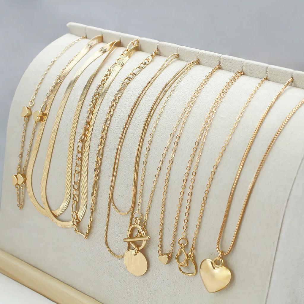 Women's gold necklace set with 10 alloy pendants on adjustable snake bone chain