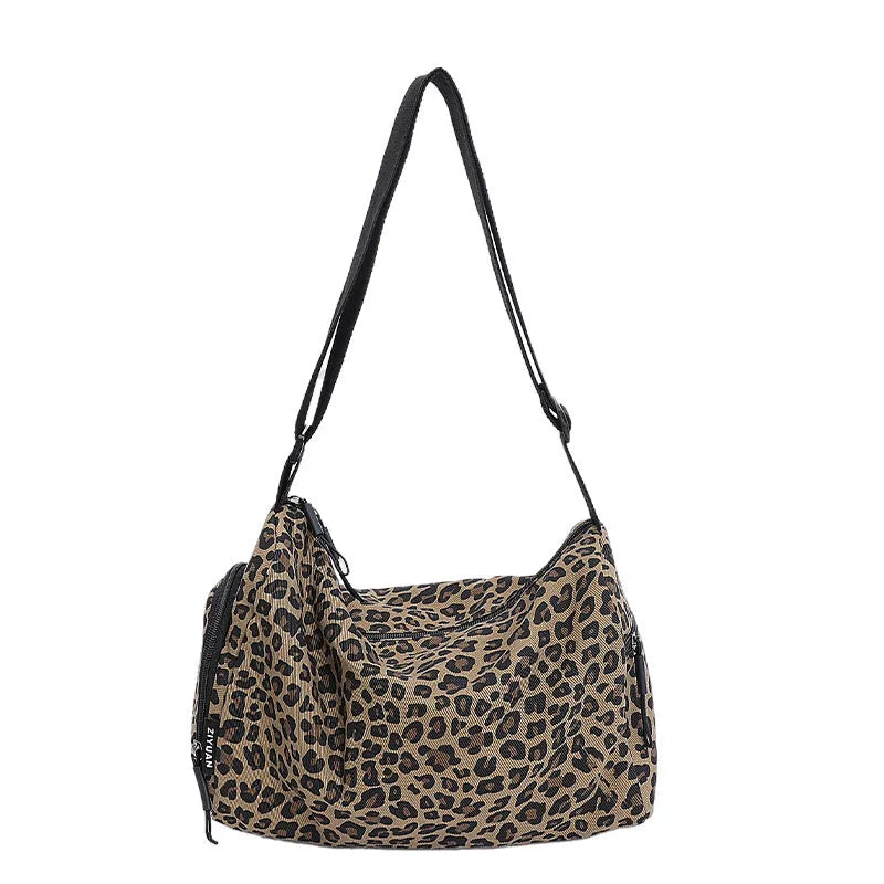 Large capacity leopard print sports style shoulder messenger bag with cloth construction and stitching details