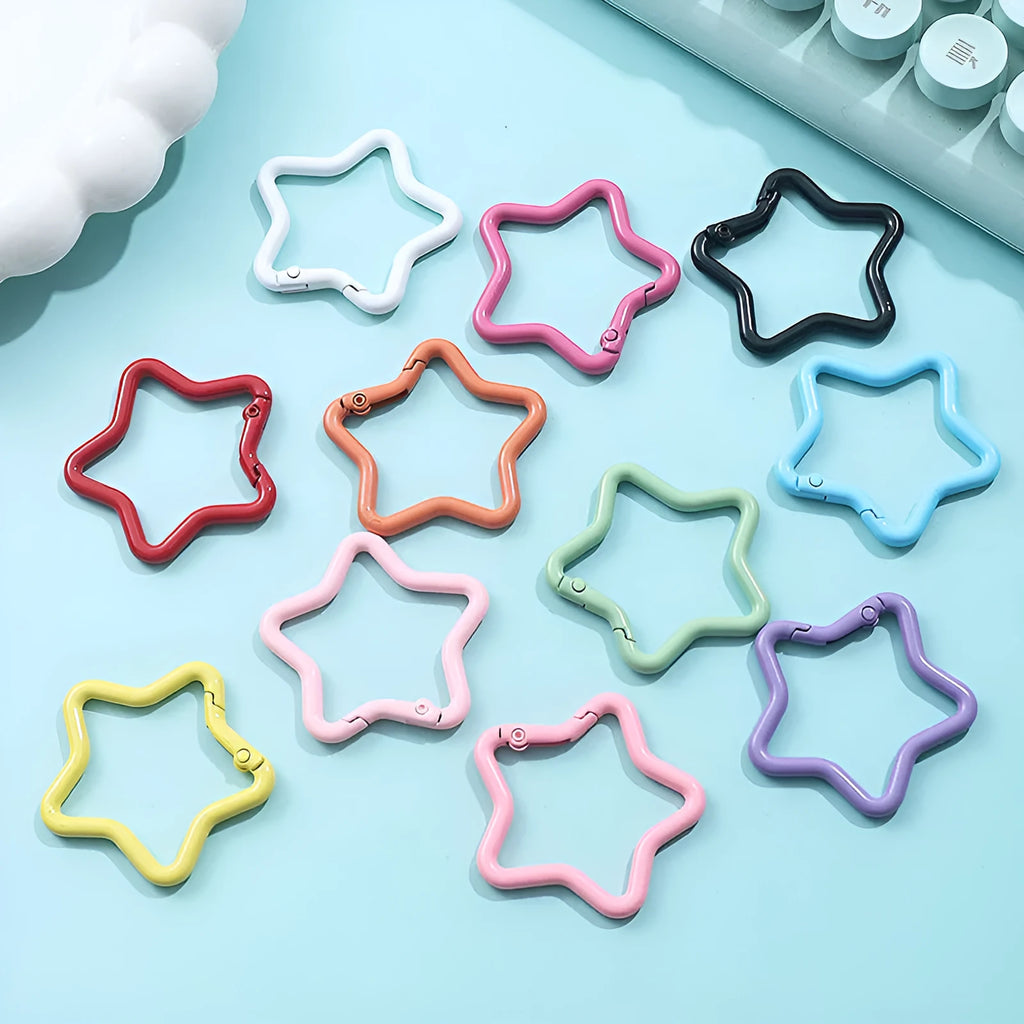 Zinc alloy five-pointed star keychain charm in multiple colour options on a keyring.