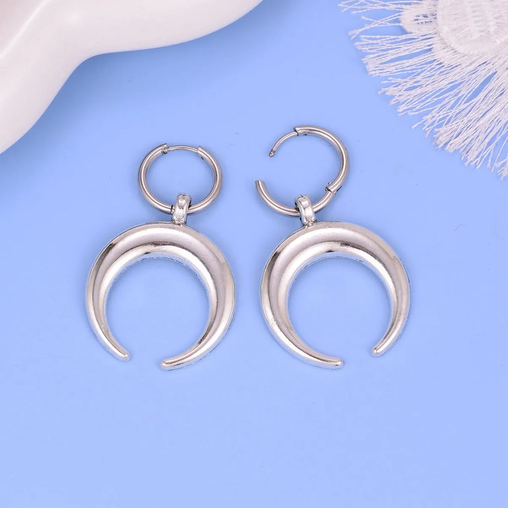 Silver vintage gothic moon big hoop earrings with geometric design and ear clip fastening