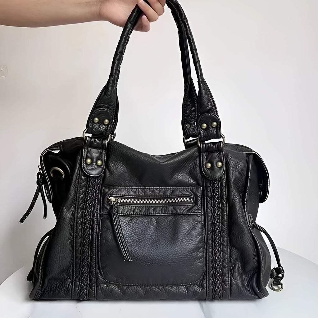 Women's brown retro shoulder messenger bag made of soft PU, showing weaving detail and a single strap.