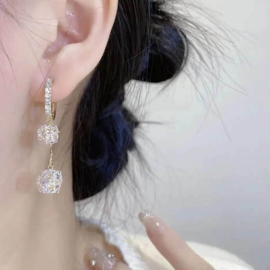 Silver copper earrings with tassel ball and rhinestone ball design in drop shape
