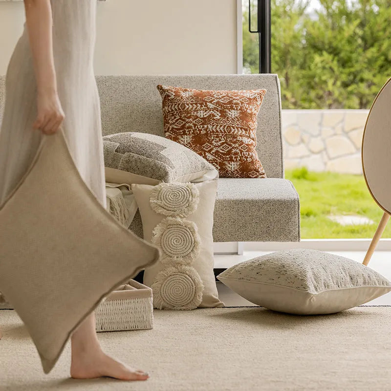 Solid colour sofa cushion pillow on a chair, showing artificial line edge pressing detail.