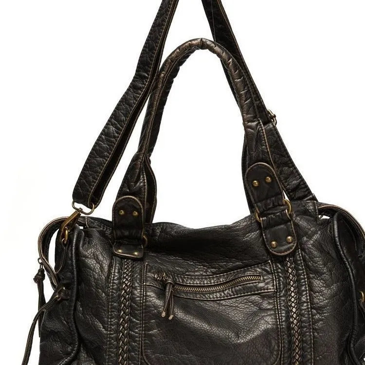Women's brown retro shoulder messenger bag made of soft PU, showing weaving detail and a single strap.