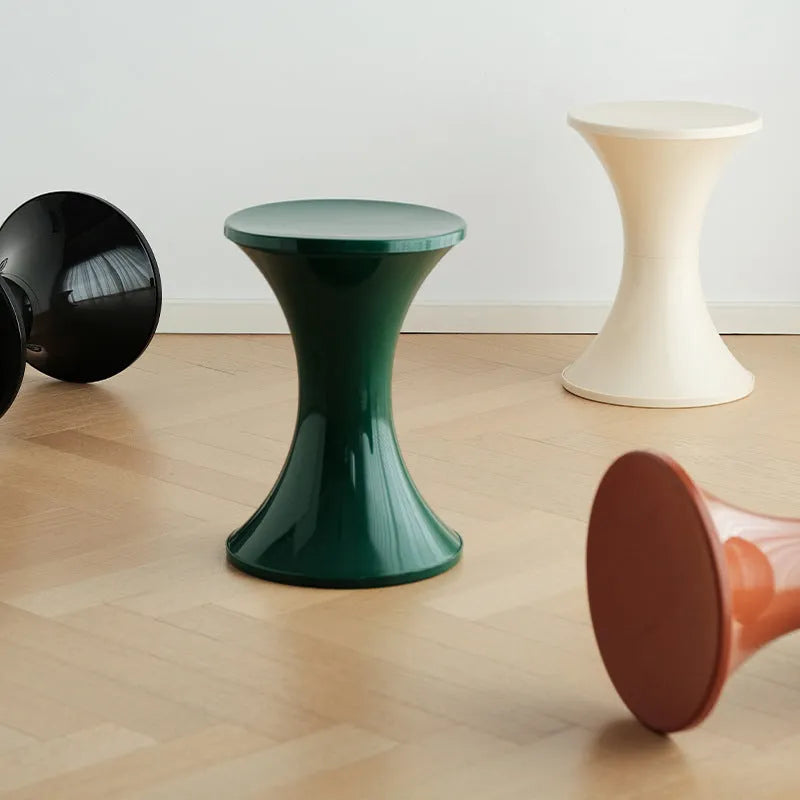 Plastic hourglass-shaped shoe changing stool in selected colour