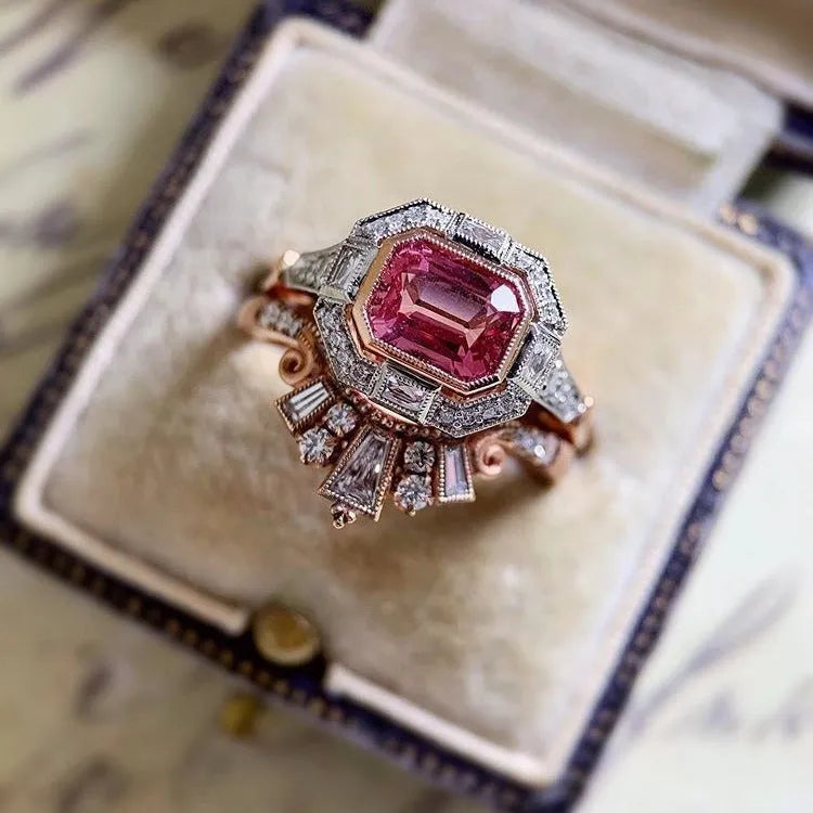 Rose gold-tone women's retro style ring with geometric ruby design on a hand.