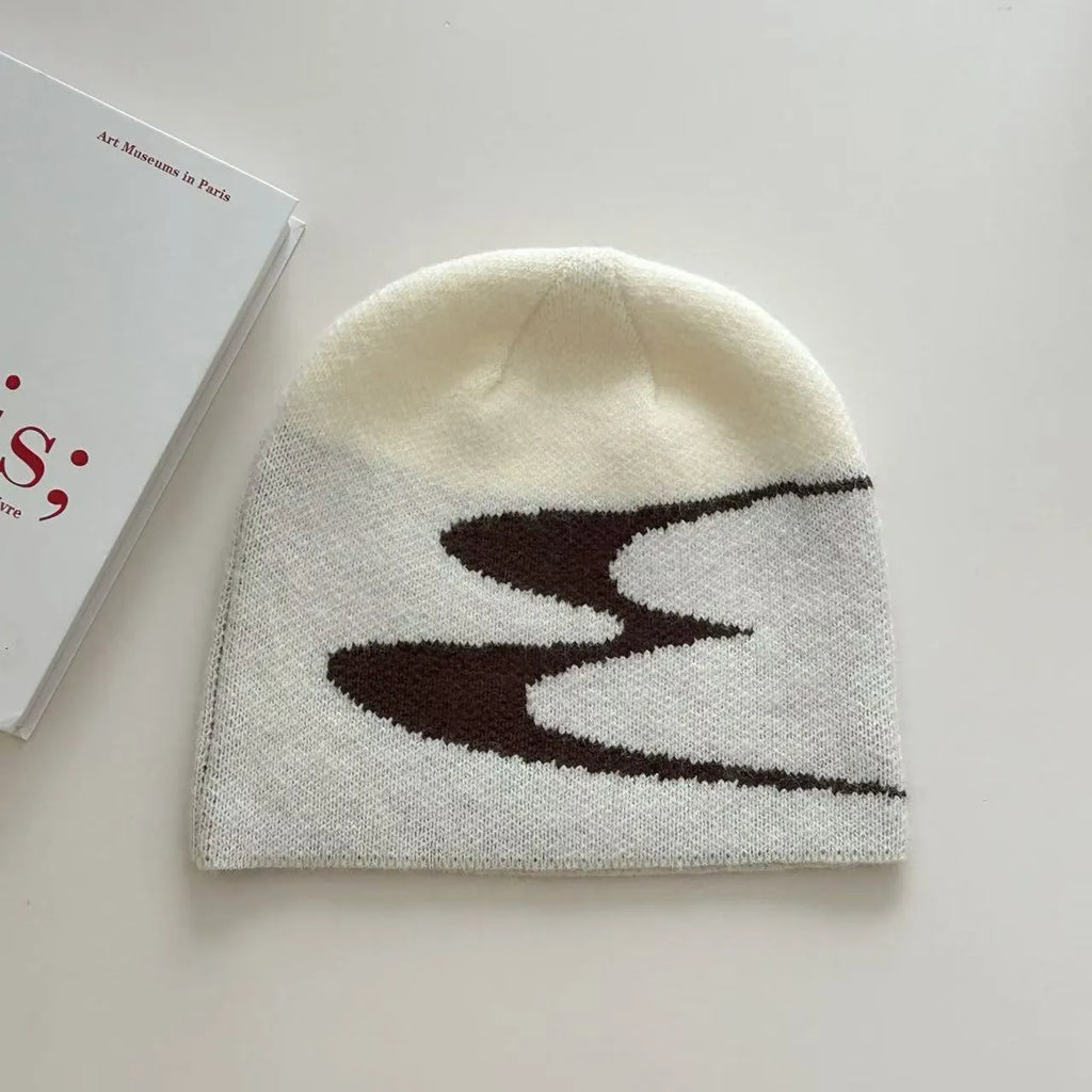 Acrylic knitted beanie hat in black colour showing thermal winter cap design