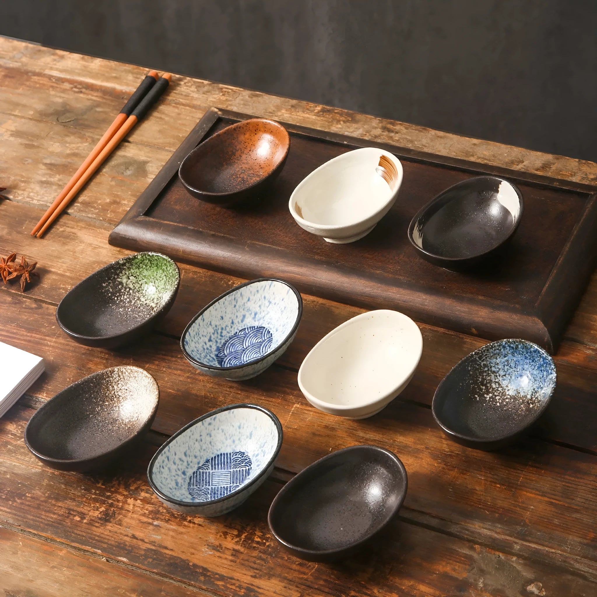 Oval Japanese ceramic sauce dipping bowl with Edo pattern design on underglaze surface