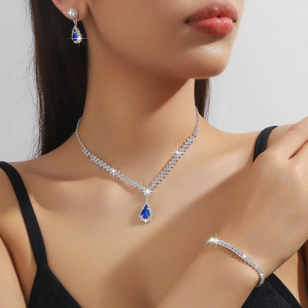 Rhinestone claw chain necklace and earrings set with water drop shape, available in multiple colours for women.