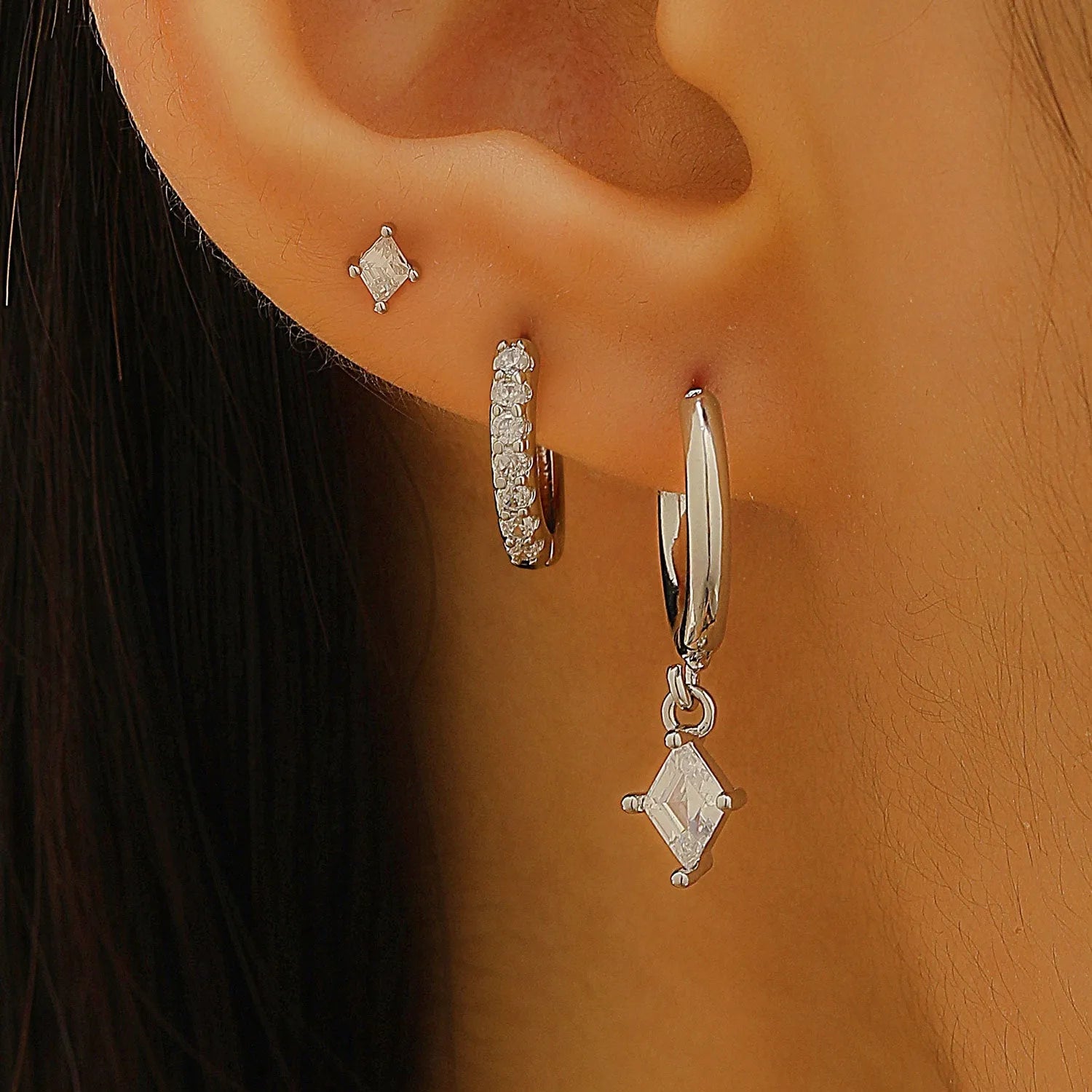 Copper jewellery three-piece set showing ear ring, ear clip, and ear studs with geometric zircon designs