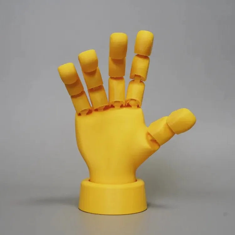 Yellow PLA movable joint hand prop for animation and photography measuring 5x5.38x7.5 cm