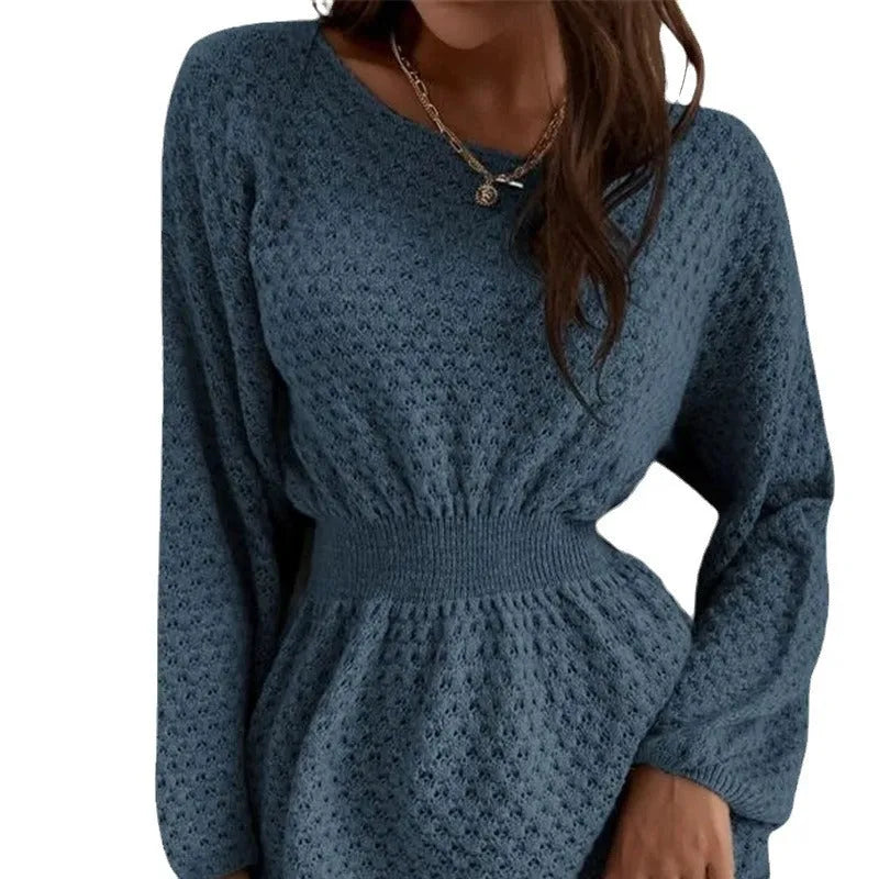 Blue women's knitted dress with French neckline, fitted waist, and hand-crocheted flower detailing